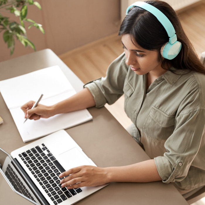 Indian girl student wear headphones